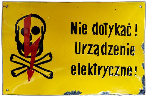 Porcelain Enamel Sign {Poland}, Black lettering and a Red lightning bolt on a Yellow background; And check out the other signs!