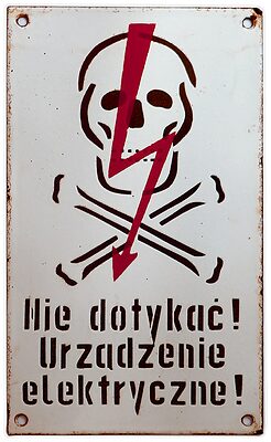 Porcelain Enamel Sign {Poland}, Black lettering and a Red lightning bolt on a White background; Classic white background and portrait orientation