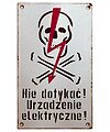 Porcelain Enamel Sign {Poland}, Black lettering and a Red lightning bolt on a White background; Classic white background and portrait orientation